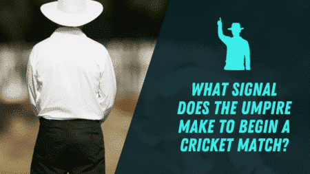 What signal does the umpire make to begin a cricket match?
